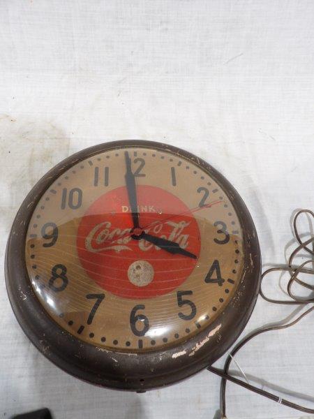 GE Coca-Cola clock: The center coca-cola portion of dial appears to be Smaltz but unsure? Frame has heavy scratches and stuffing. Clock does not run. 15 inch diameter.