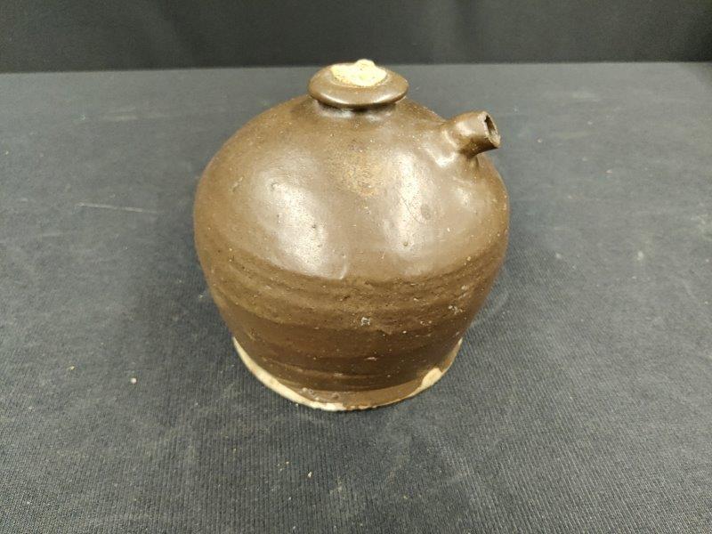 Unusual small brown crock with pour spout: .