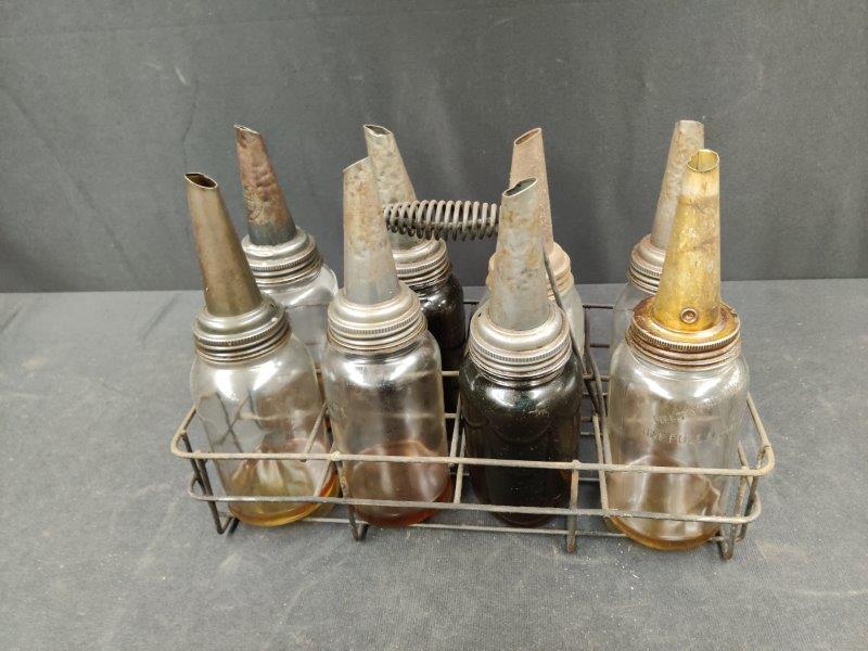 Set of 8 early oil bottles in rack (1 of 3)