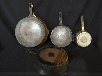 Lot of 4 cast skillets: Includes a Wagner # 10, and unmarked # 8, a Wapak # 6 and an aluminum Griswold # 3 hammered with wooden handle. 3 cast iron skillets have rust and need cleaned.