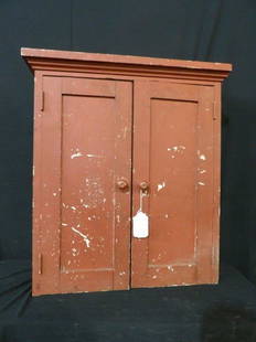 Nice small primitive painted 2 door cabinet: Red over gray painted cabinet with awesome gray painted cubby interior. 23 in wide 9 inch deep at crown 26 in tall.