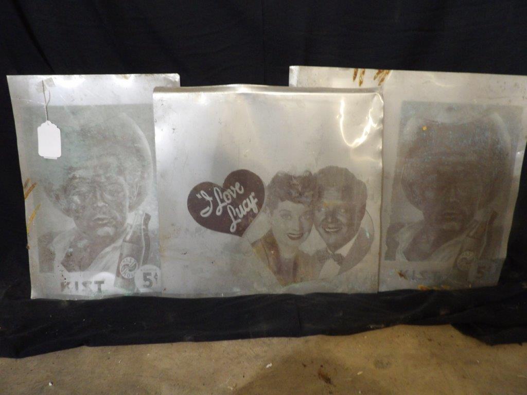 3 Tin negatives: Includes 2 Kist Kola 5cent and one I Love Lucy. All three appear to be cut. Biggest one is 19 in x 18 in smallest 1 is 12 1/2 in x 18 in.
