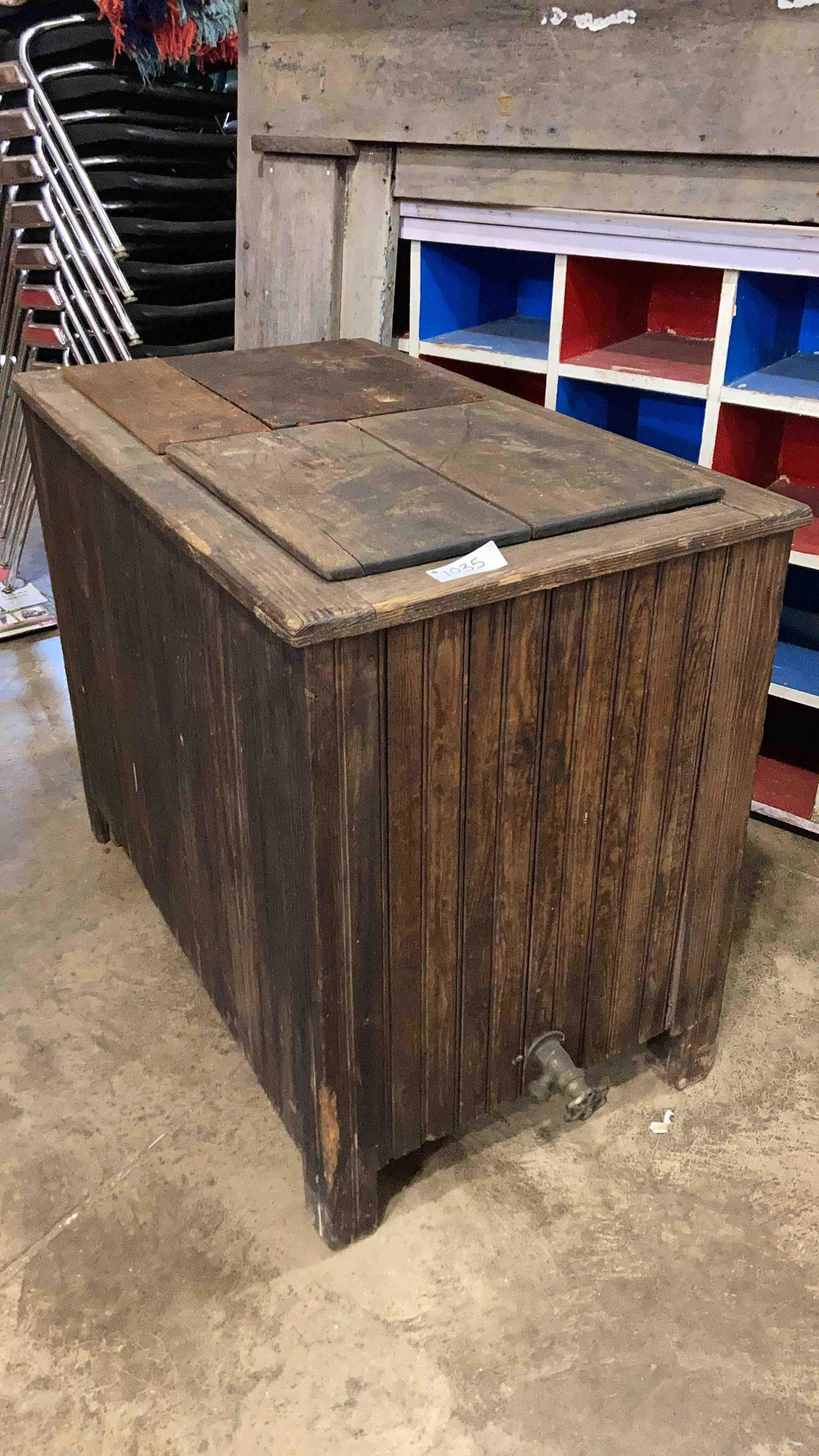 Wooden Ice Box: Tin lined chest cooler. Has some rust on the inside of the compartments. One lid has been replaced.