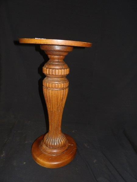 Oak fluted stand: Some scuffing to finish in areas and minor separation at glue joints. Top is 13 in in diameter and is 25 in tall.