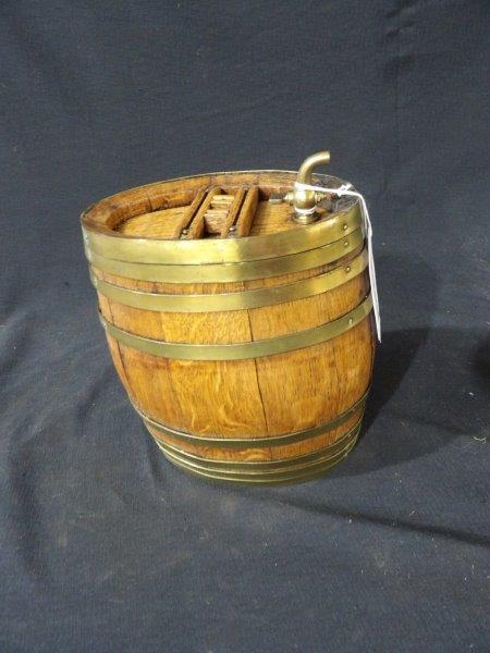 Whiskey barrel / dispenser: Nice condition with brass bands and spout. Approximately half gallon capacity 7 3/4 in when standing on end.