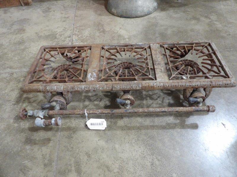 Griswold 3 burner hot plate: Shows corrosion but no apparent cracks or chips. 10 in x 30 in.