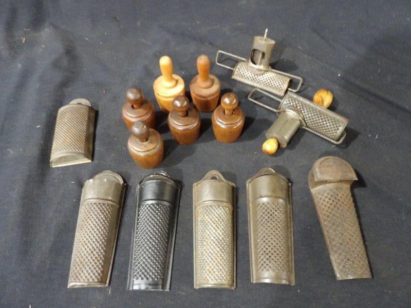 8 Small nutmeg graters & 6 small butter molds: 2 of the nutmeg graters are sliding and others are pouches. Butter molds all have various patterns and are approximately 3 in tall. Graters are all similar in size ranging from 4 to 5 in Long.
