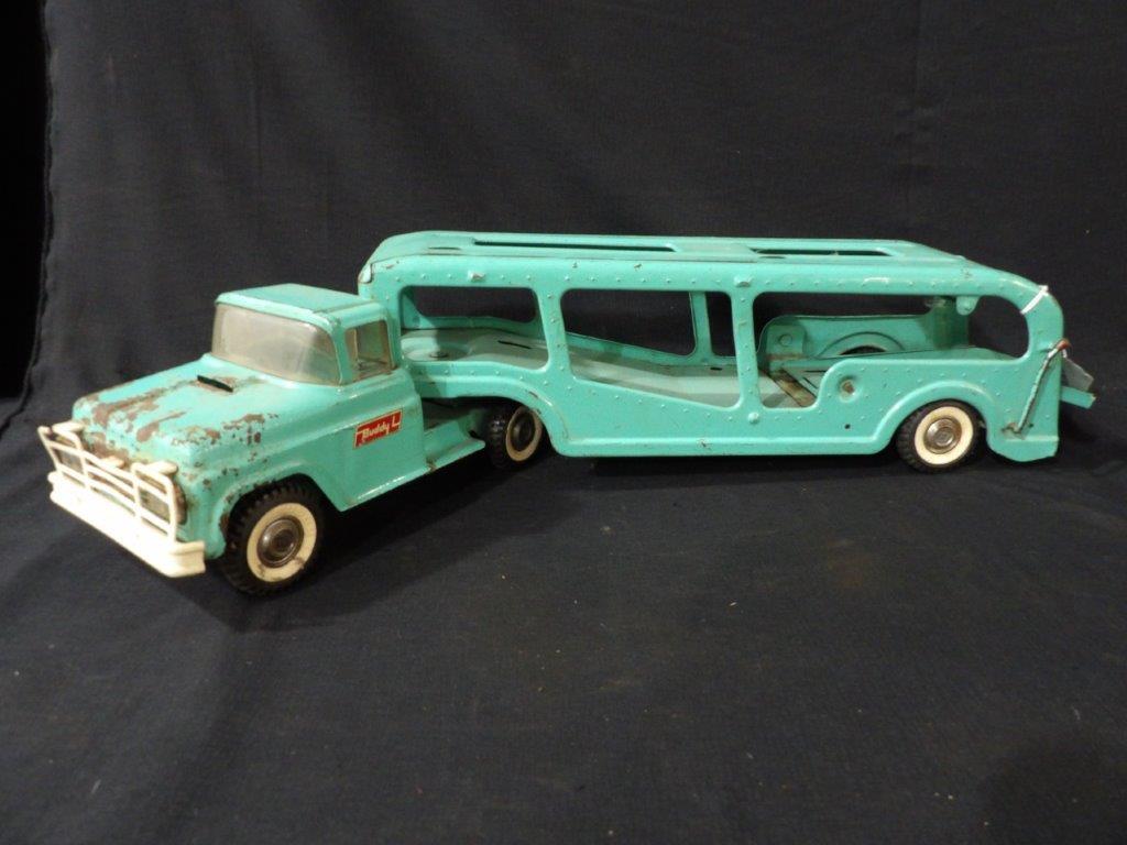 Vintage Buddy L Transporter: Showing condition issues due to age and usage. Rusting and paint loss. Great Teal Color 26 1/2" L
