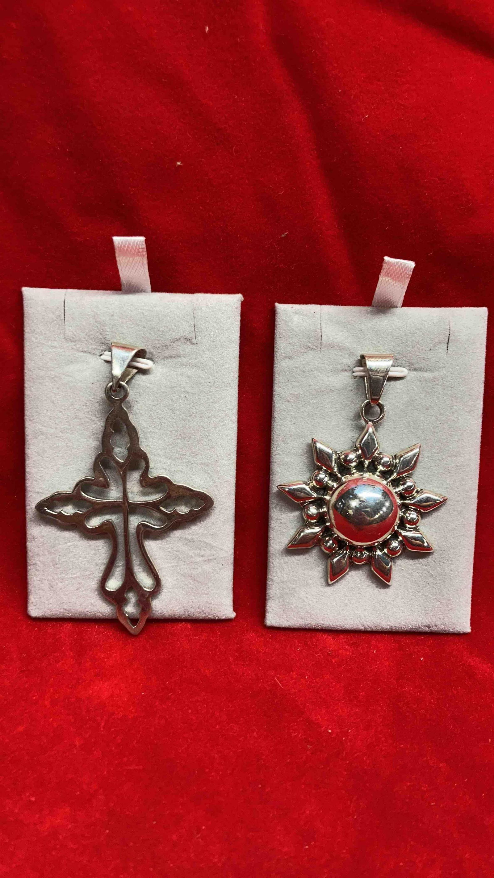 2 STERLING PENDANTS: 1 IS CLEARLY MARKED .925, OTHER IS UNREADABLE.