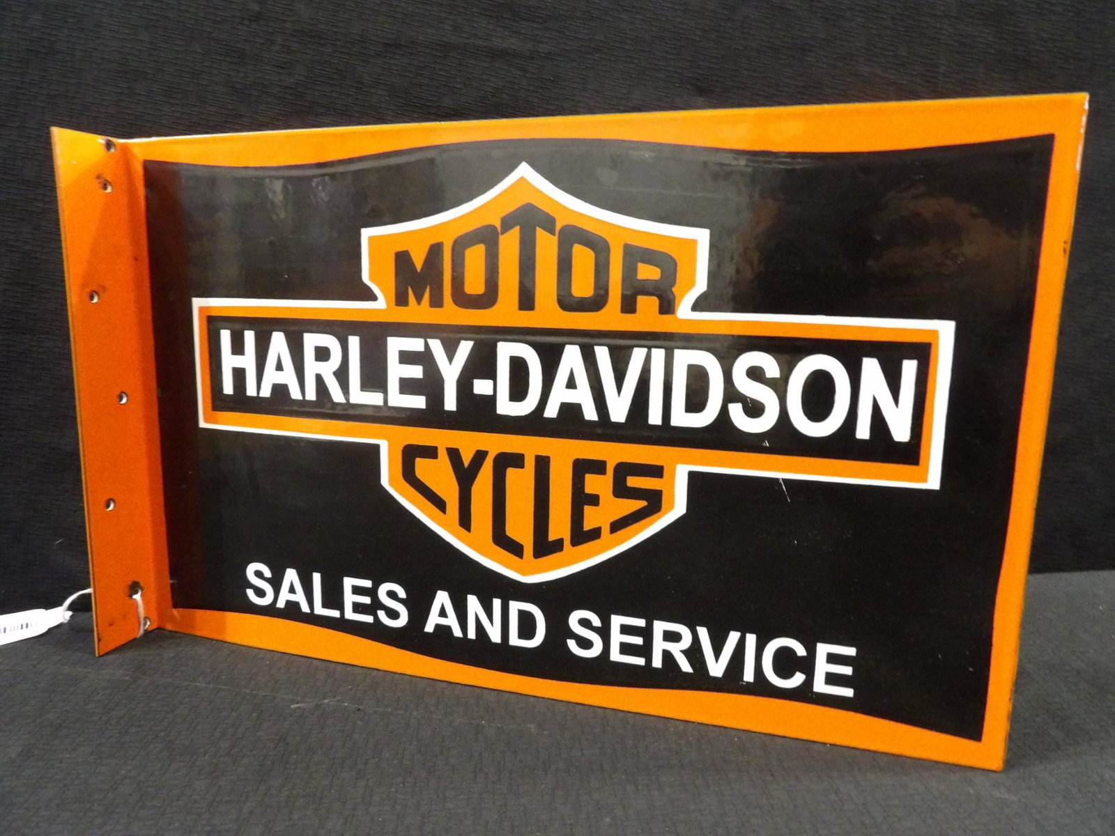 Newer Harley-Davidson porcelain flange sign: 10 inches x 16 1/4 in.