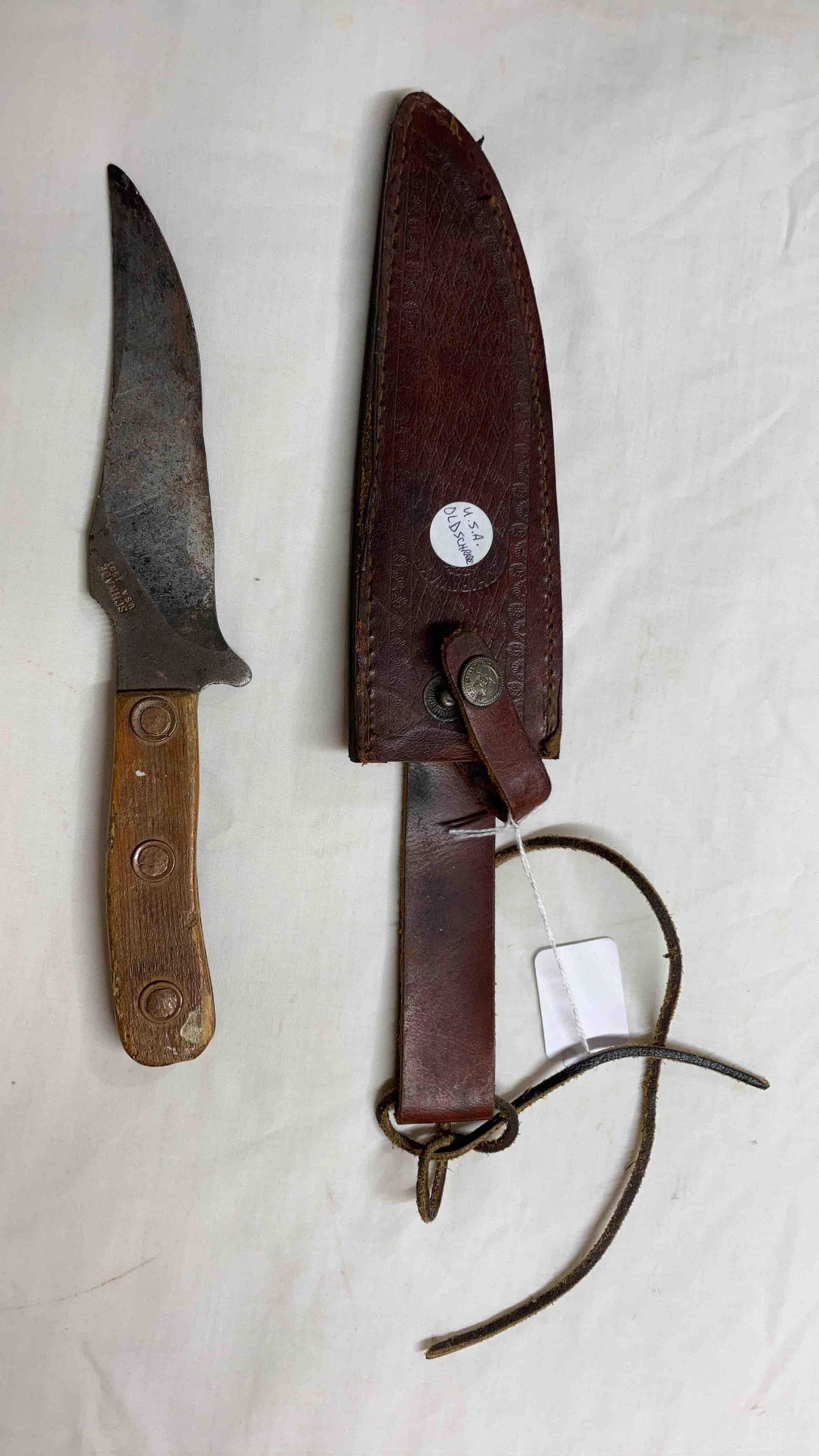 USA Schrade Knife: Fixed blade knife. Blade has heavy rust and corrosion with scrapes and scratches. 10 inches.