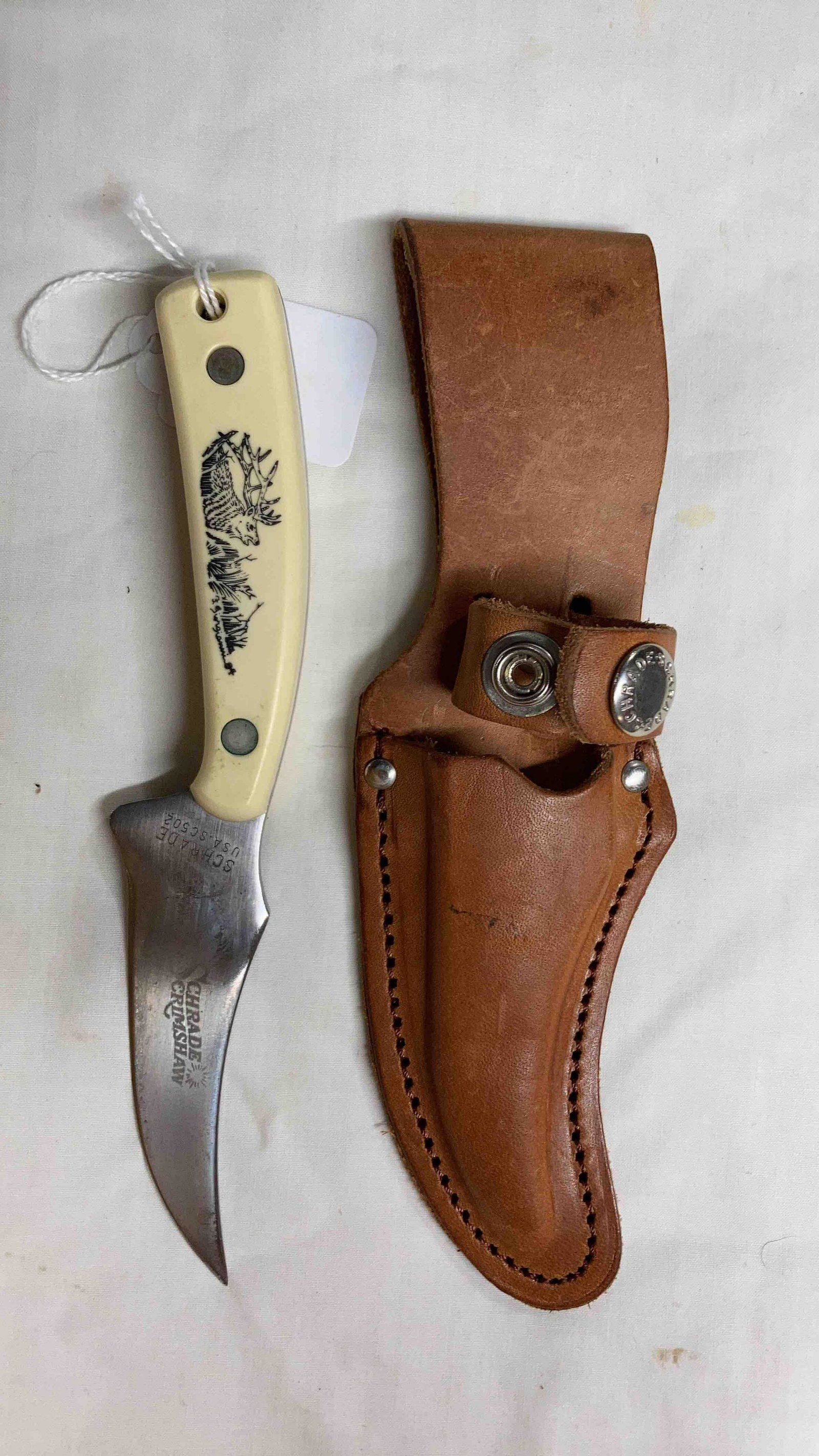 USA Schrade Scrimshaw Knife: Fixed blade knife with deer handle and leather sheath. 7 inches overall.