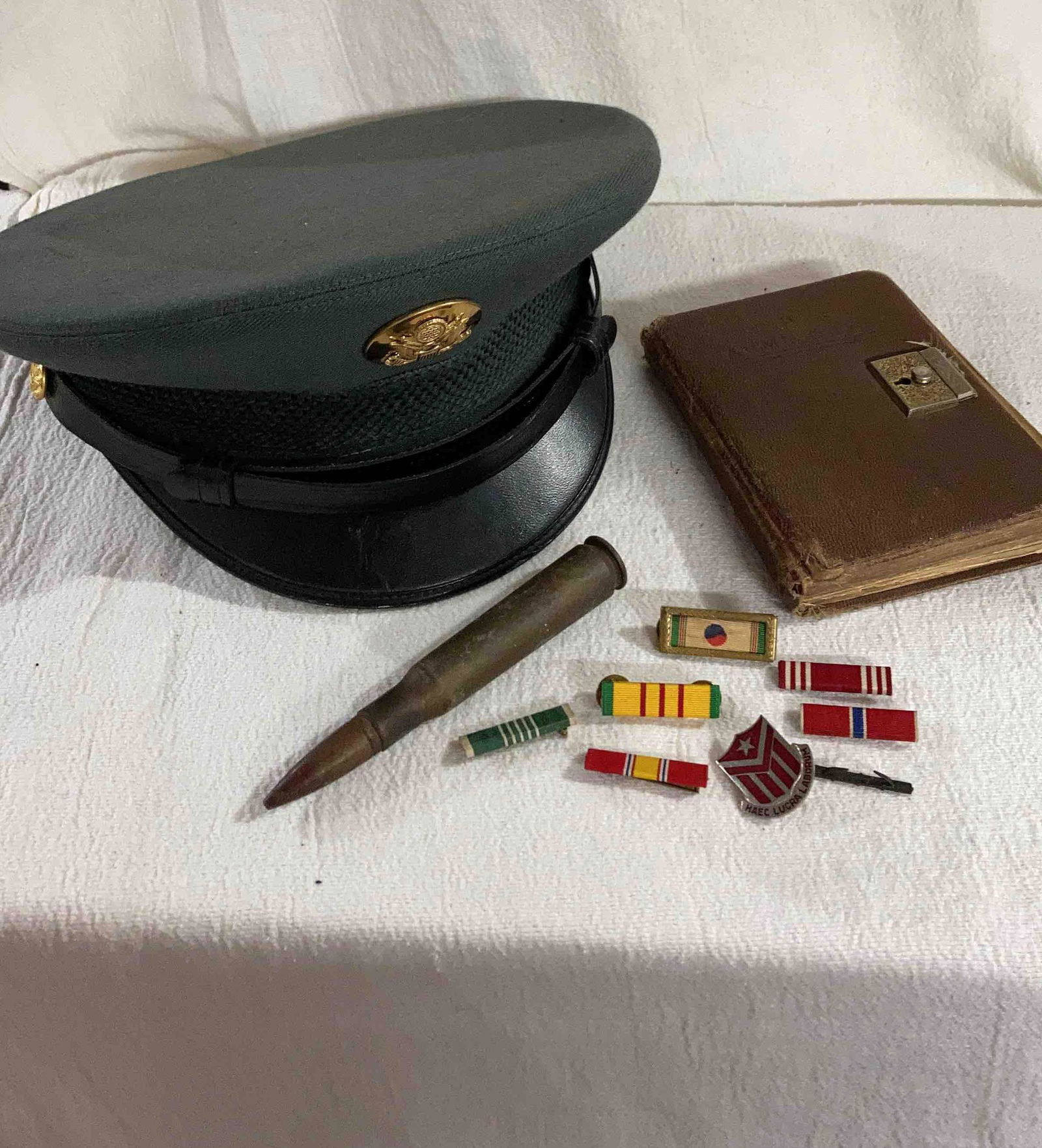 MILITARY AWARDS, CAP, ARTILLERY SHELL AND ARMY DAYS BOOK (1 of 11)
