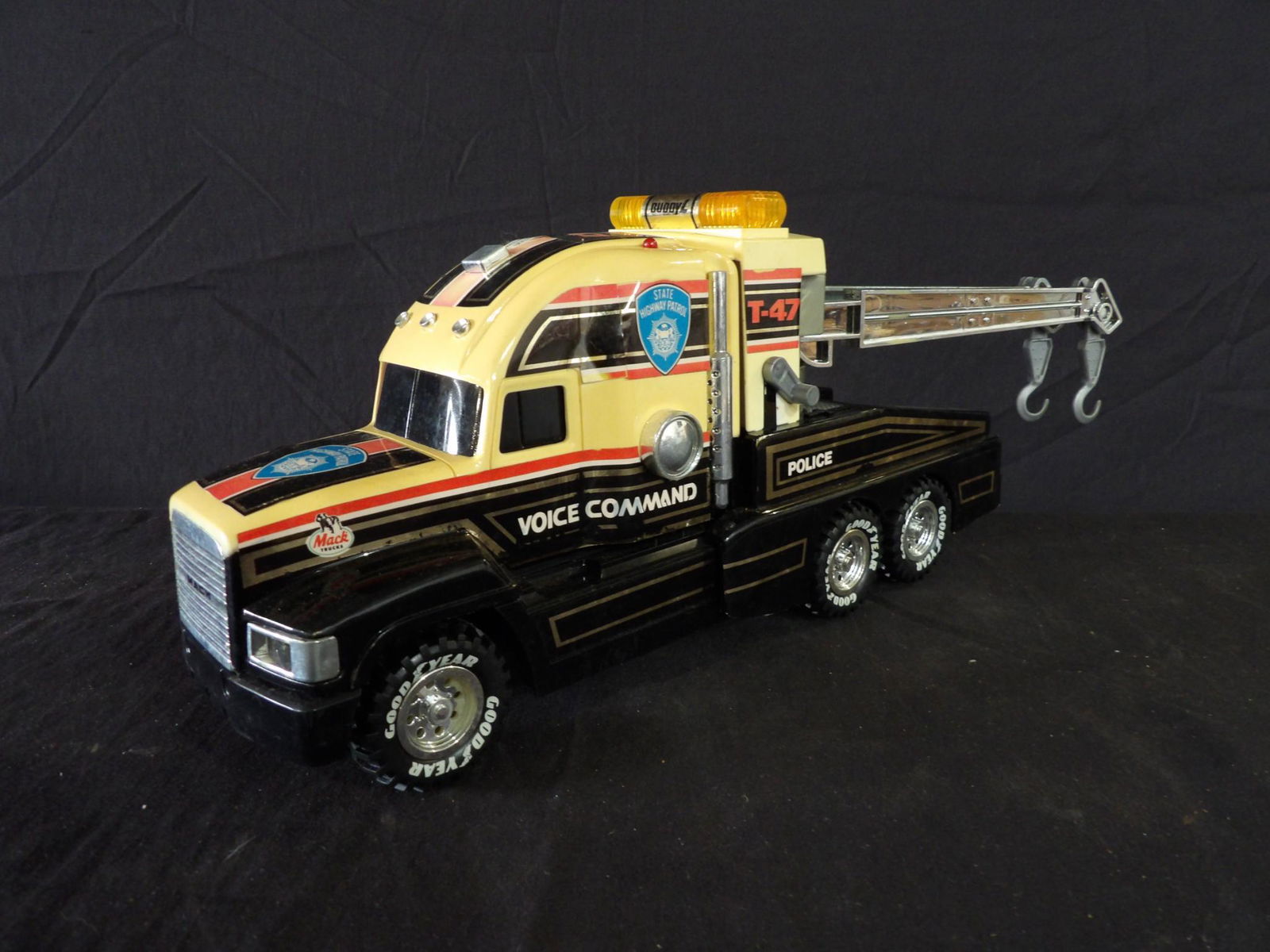 VINTAGE BUDDY L GOODYEAR STATE HIGHWAY PATROL/POLICE MACK TRUCK T-47: USED OUT OF BOX IN GOOD VINTAGE CONDITION SHOWING DISCOLORATIONS DUE TO AGE AND DISPLAY 15 1/2" L