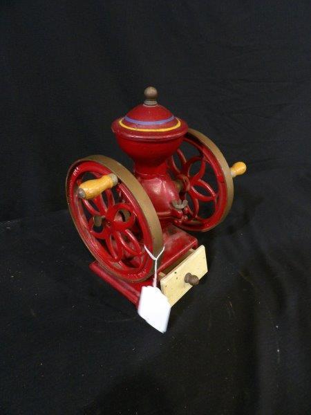 Small John Wright Inc. coffee grinder: Wrightsville, PA. With wooden drawer, wheels are 6 3/4 in in diameter overall height is 11 1/2 in and 6 1/2 in wide.