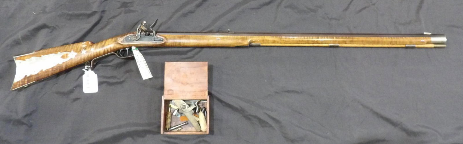 Beautiful 50 caliber full stock Flintlock target rifle: Awesome Tiger Maple stock with beautiful inlay and storage box in rear of stock. Does have a few handling marks but overall is in great condition! With octagon 28 1/4 in Barrel, also comes with a smal