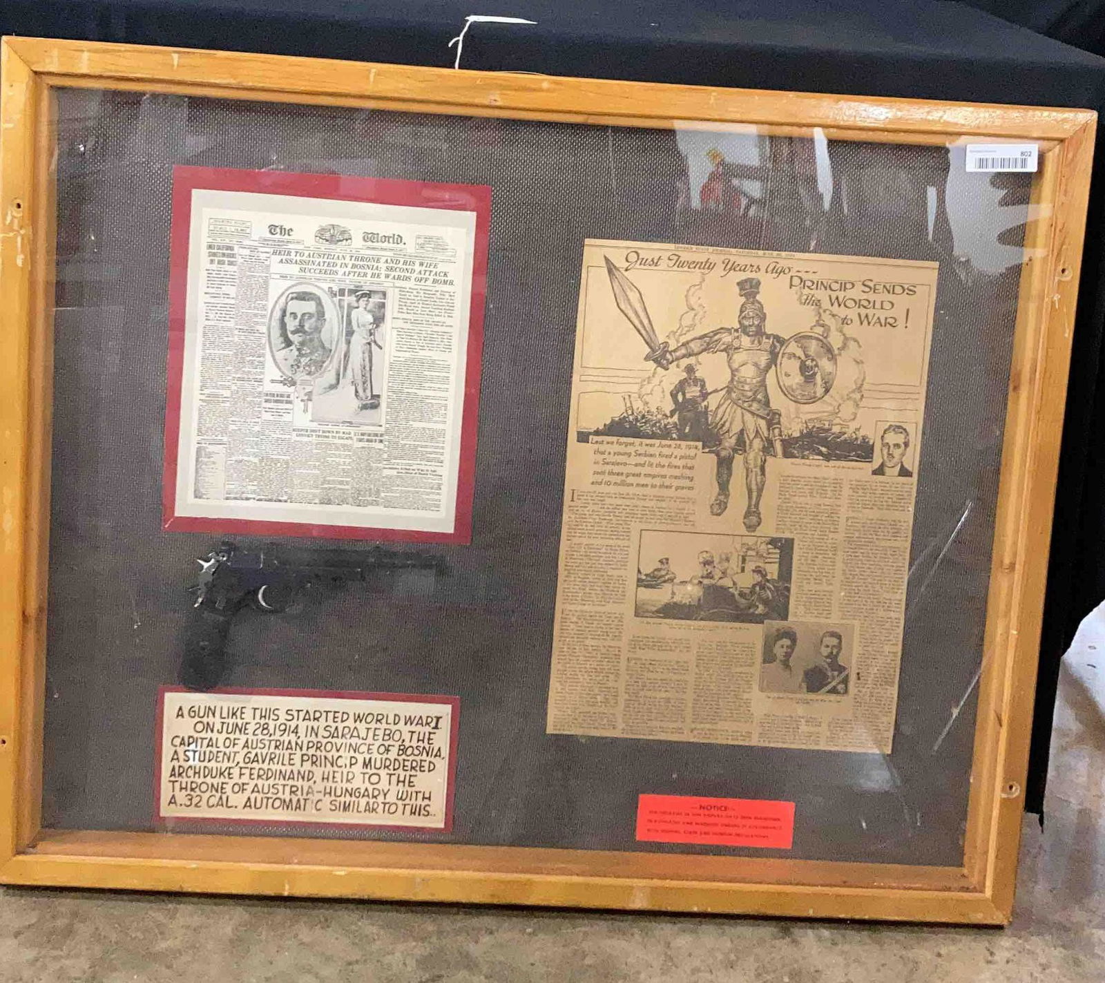 How WW1 Was Started: Newspaper article explains how a young Serbian boy shot and killed ArchDuke Ferdinand and started World war 1. Displayed is a .32 Cal automatic pistol similar to the one used. Gun is for display purpo