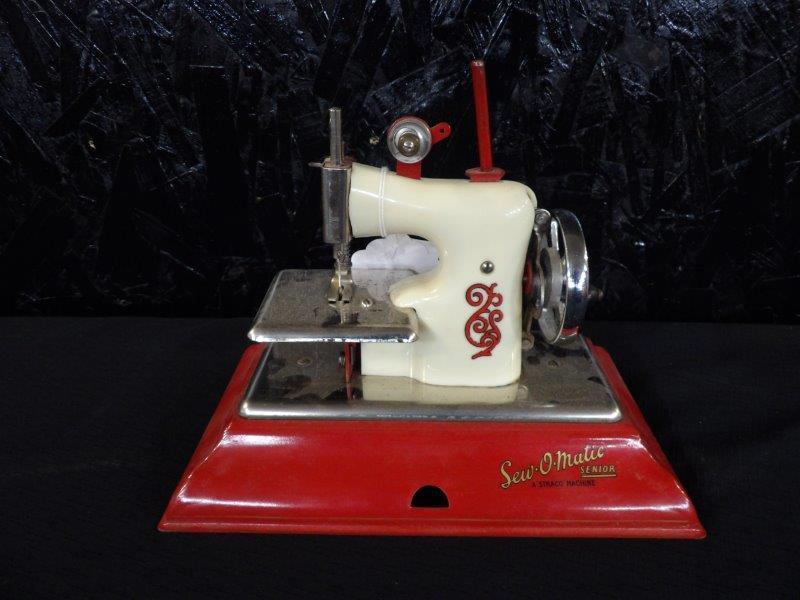 Sew O Matic Miniature Sewing Machine: In working condition, everything moves as it should. Sew O Matic senior. A attack machine. Made in England. Good condition.