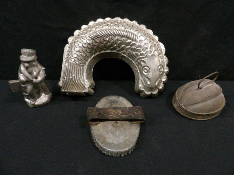 Chocolate Molds & Tins: Uncle Sam chocolates mold in 6" tall, E and Co NY. Serpent mold 12". And other various tins and cutter.