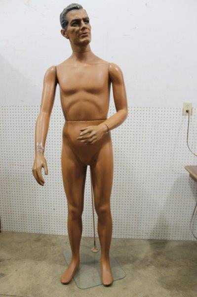 Realistic Male Mannequin: This man has realistic facial features with blue eyes and a charming hair style. He stands at 71" tall. His right hand has been taped and there are a few dings and areas of cracking with a small hole