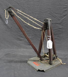 Early Samson The Industrial Collapsible Derrick: Mfg. by Kiddies Metal Toys Inc. Great early toy mounted on metal platform, with original labels, shows some wear but is a good solid piece. With replaced strings. 19" tall.