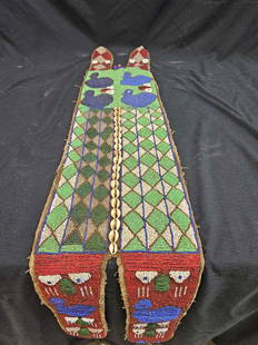 African Yoruba Beaded Ceremonial Sash: Early hand stitched sash beaded with glass beads and shells. 54x34; long x 9x34; wide. This item is from the Dan Hardesty Museum.