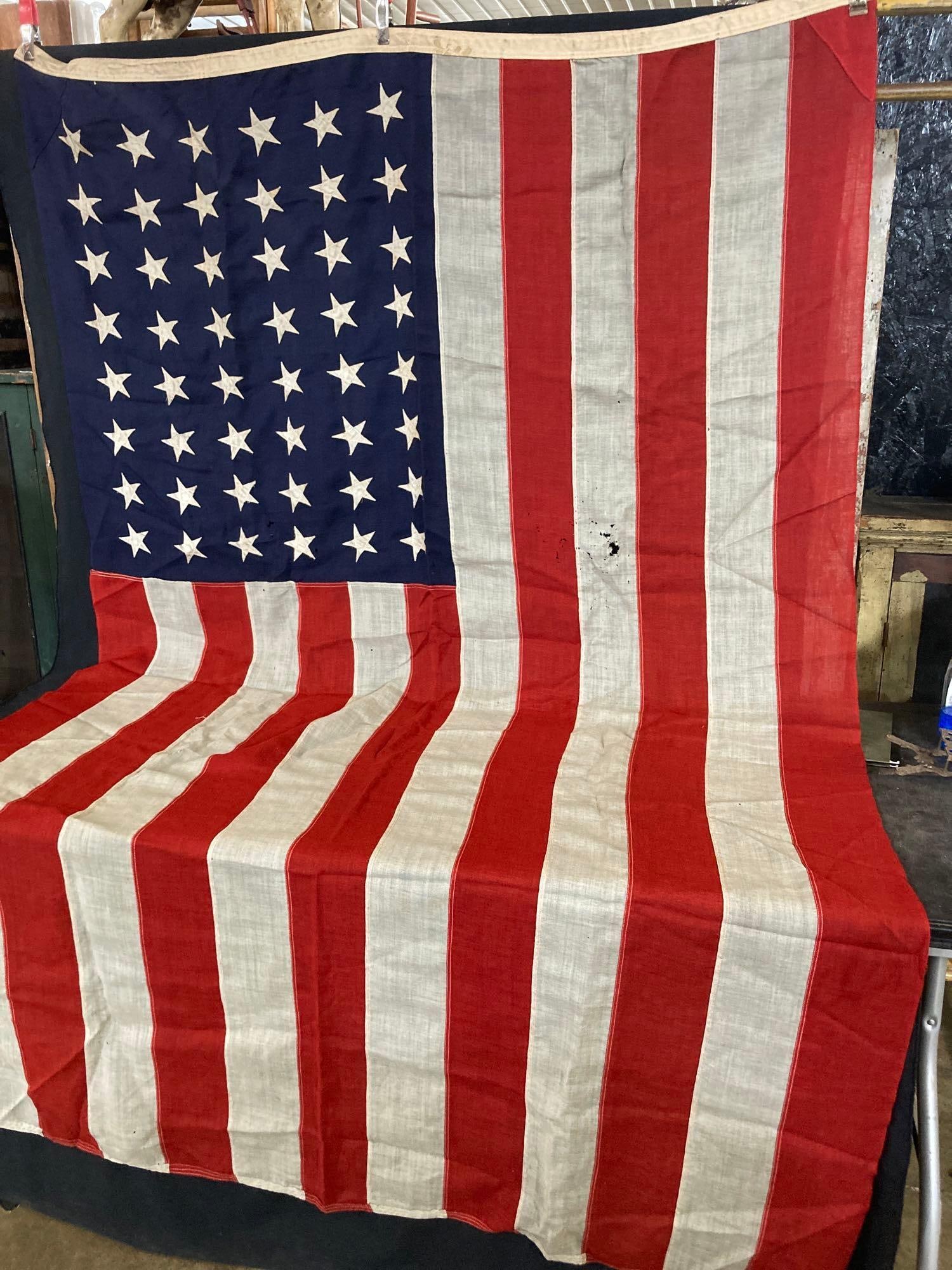 48 Star American Flag: Good color, and stitched stars. Some thinning and moth holes show in this flag. 59x 93
