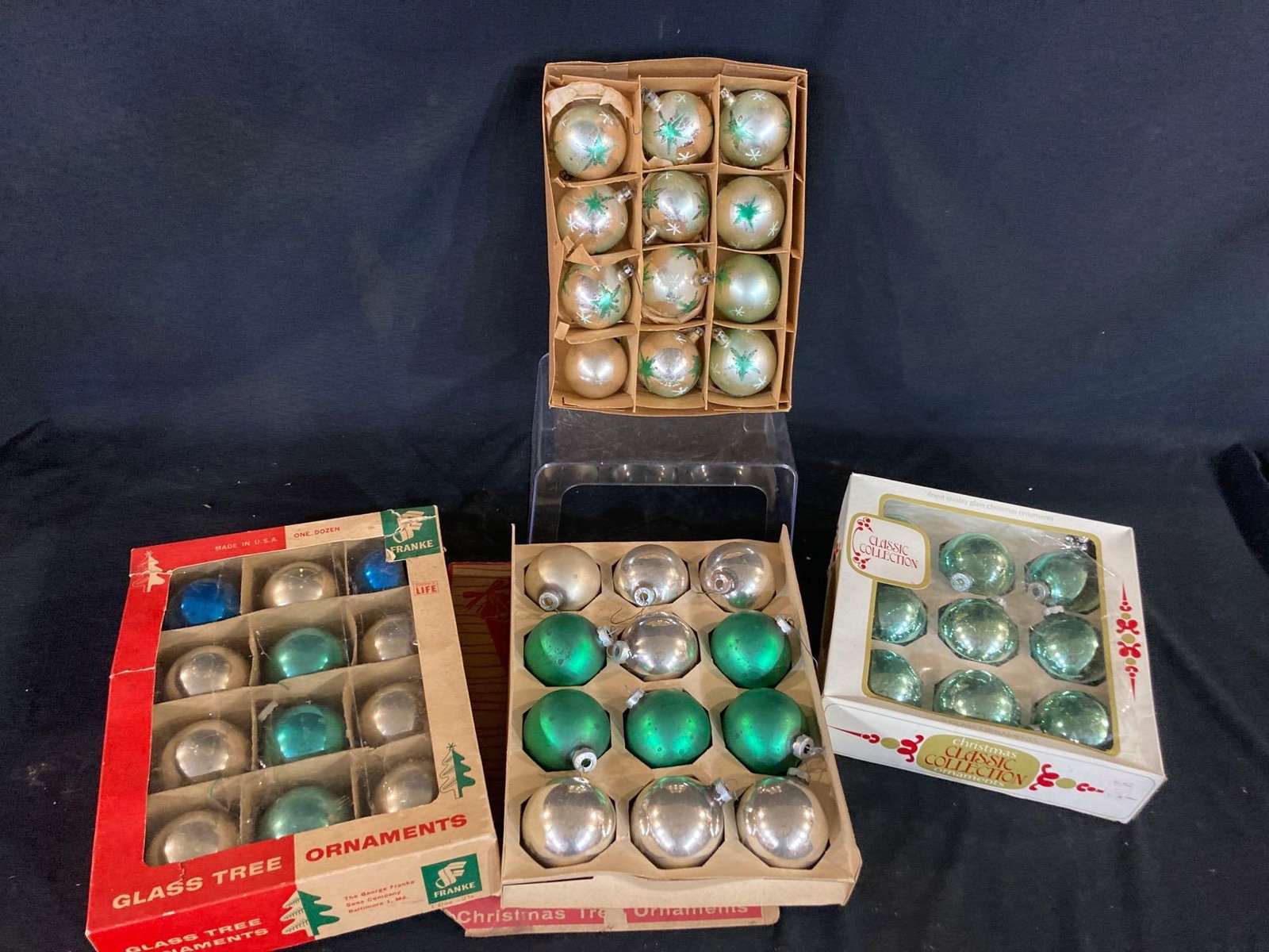 SILVER & GREEN VINTAGE BULBS: 4 BOXES GLASS ORNAMENTS. MOSTLY SHADES OF GREEN WITH A FEW BLUE AND SILVER BULBS INCLUDED