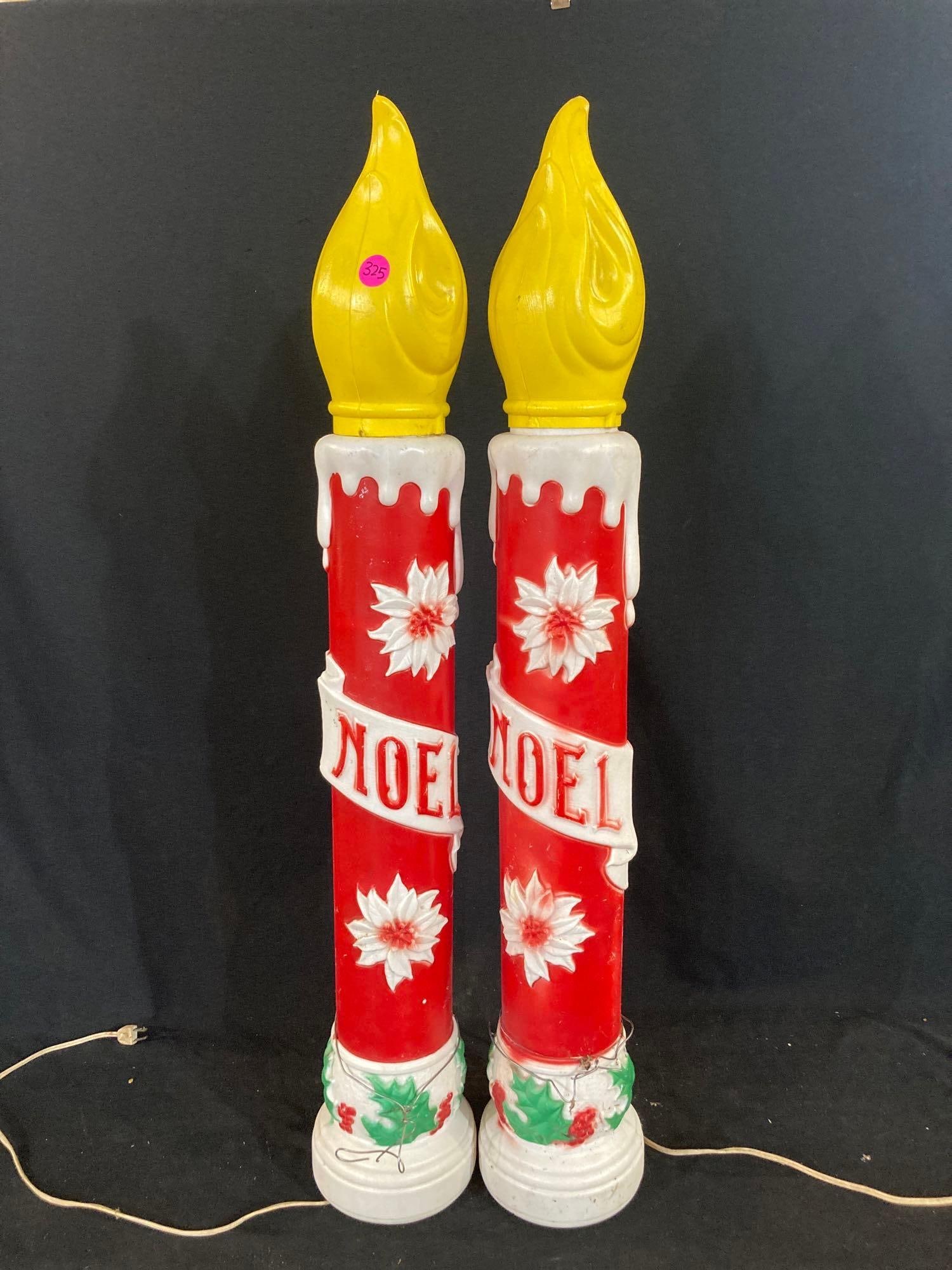 EMPIRE NOEL CANDLE BLOW MOLDS: GOOD COLOR, EACH IS 38 INCHES TALL. ONE CANDLE HAS SOME DAMAGE TO THE YELLO TOP