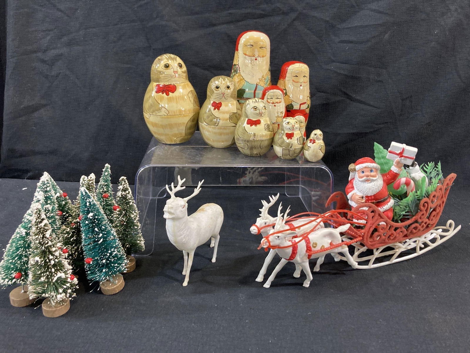 NESTING DOLLS & BOTTLE BRUSH TREES: 2 NESTING DOLLS, PLASTIC SANTA SLEIGH WITH REINDEER.