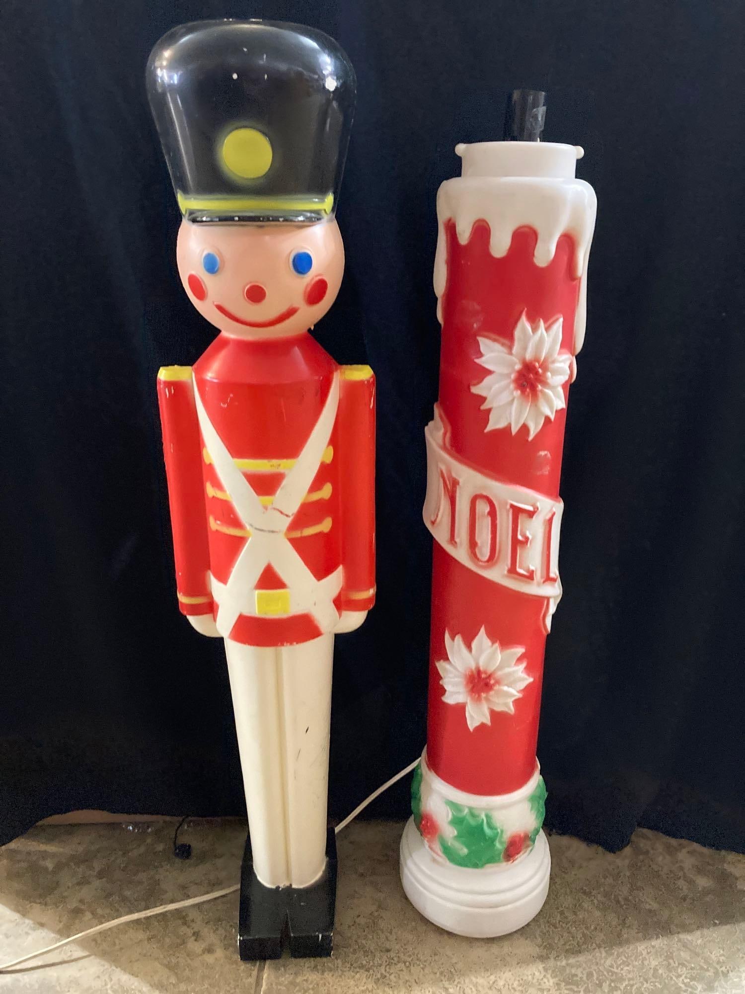 TOY SOLDIER & NOEL BLOW MOLD: PLASTIC SOLDIER STANDS APPROX 32 INCHES TALL, CANDLE IS 30 INCHES. MISSING TOP