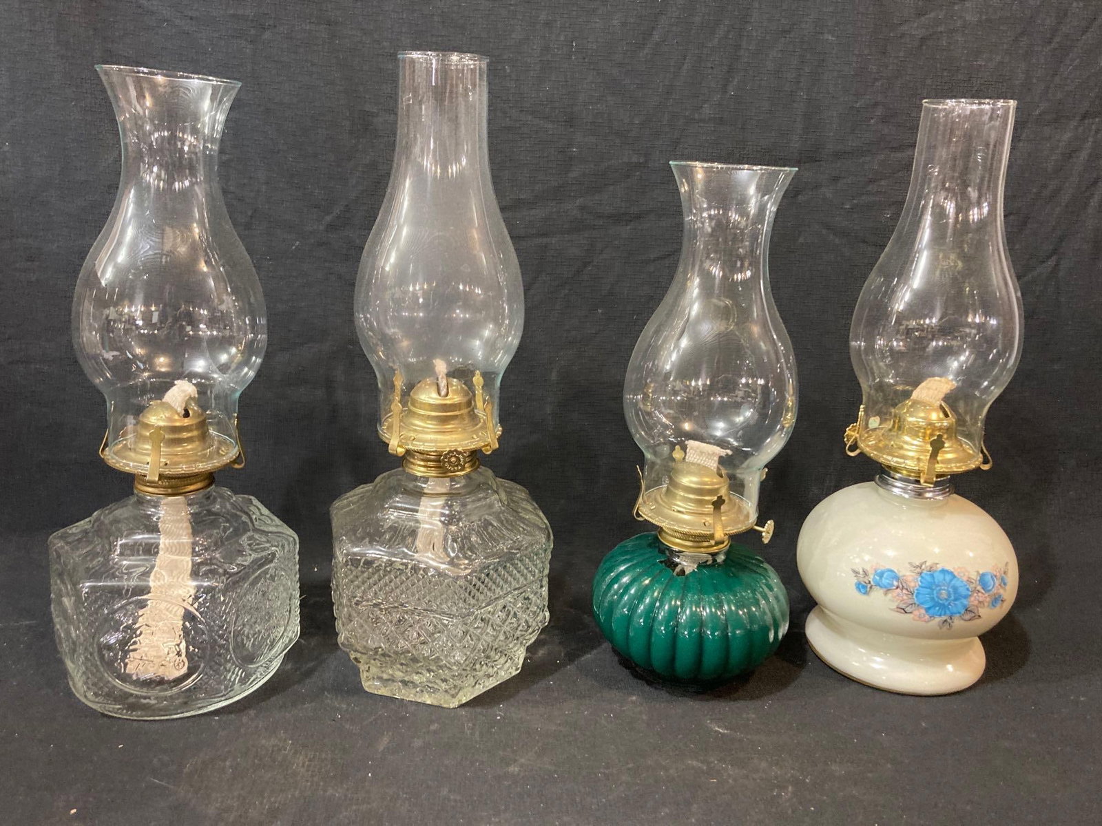 4 OIL LAMPS: ALL LAMPS INCLUDE WICKS AND SHADES