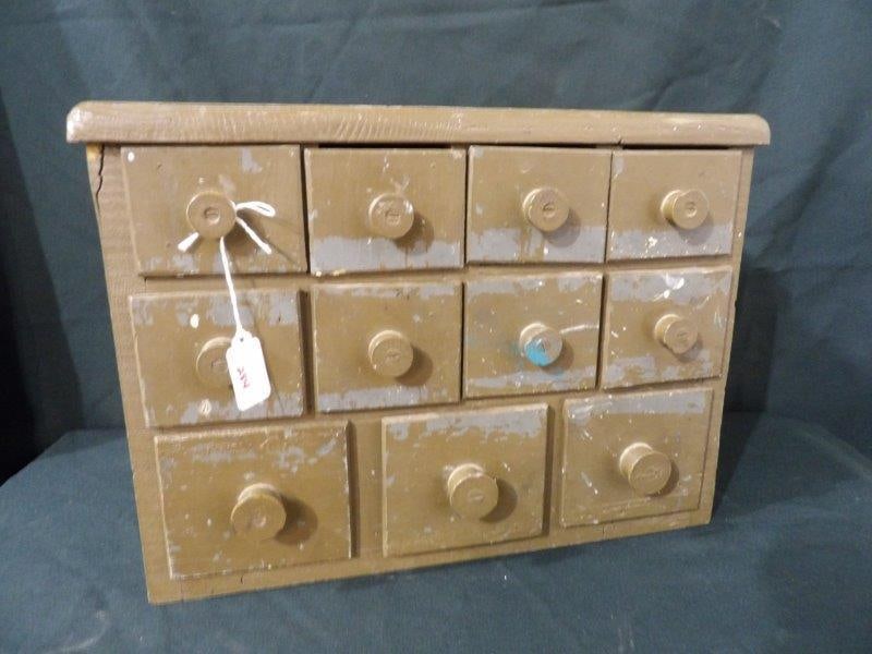 CHEESE BOX 11 DRAWER CUBBY: EACH DRAWER IS MADE FROM A CHEESE BOX. 17 X 10 X 12. WOOD ON TOP HAS A SMALL CRACK