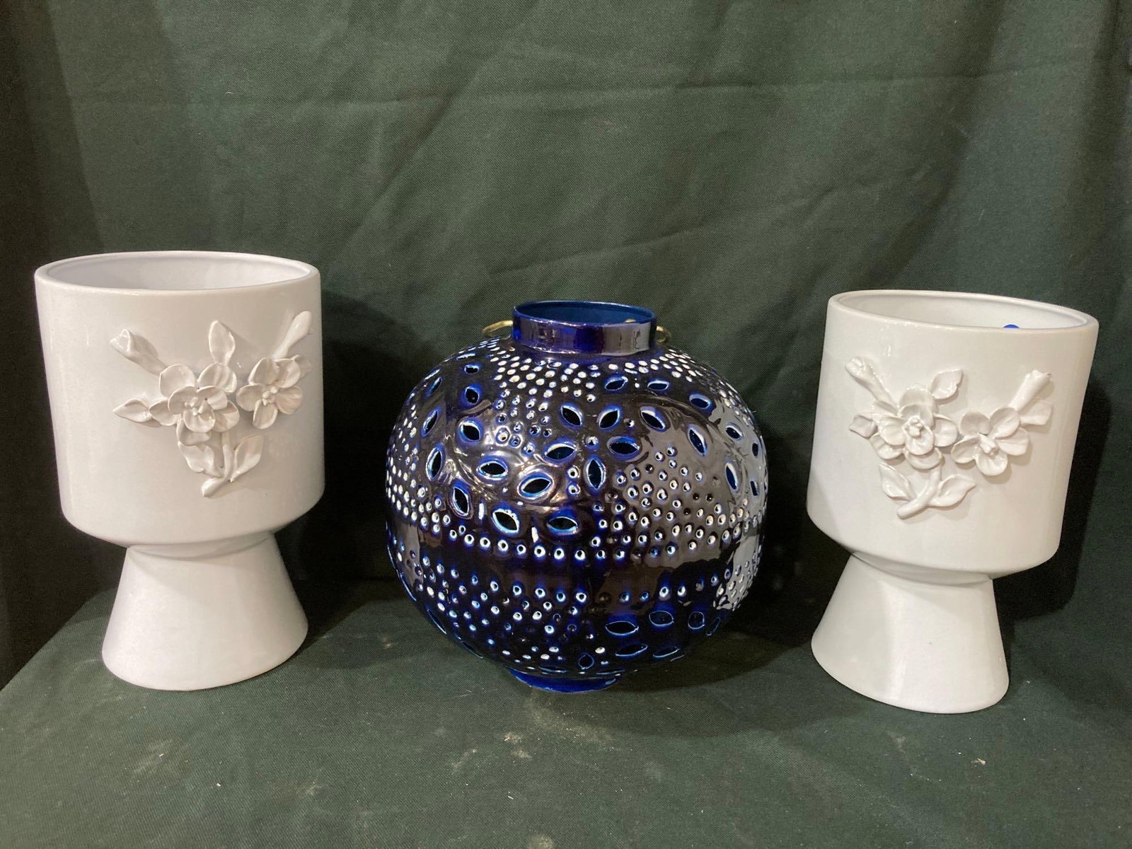 LARGE WHITE FLORAL VASES AND BLUE LANTERN: VASES ARE 12 IN TALL, LANTERN IS 11 IN TALL