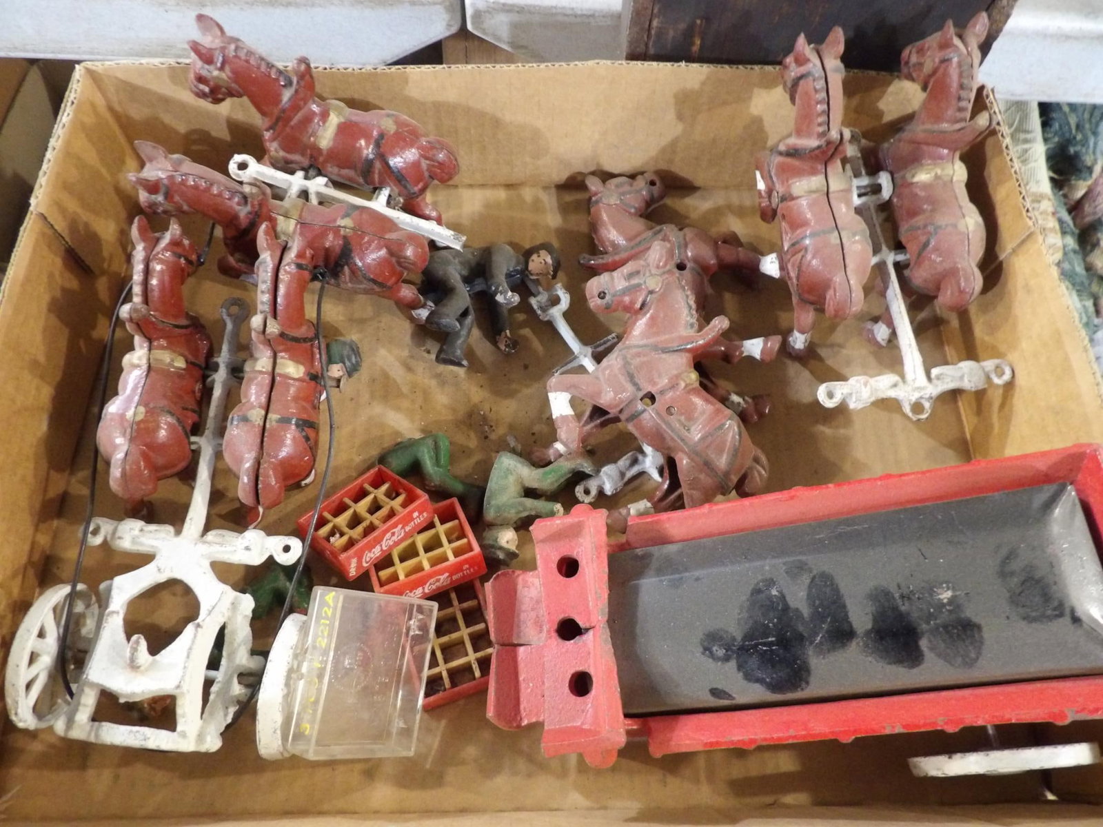 CAST IRON TEAM WITH WAGON: INCLUDES FIGURES, 8 HORSE TEAM AND PLASTIC COKE CRATES.