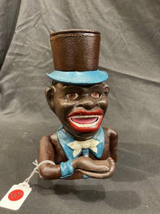 BLACK AMERICANA CAST IRON JOLLY BOY BANK: 8 INCHES TALL. THIS IS A NEWER CAST IRON PIECE