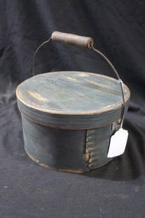 Primitive blue pantry box w/bale handle : 9 1/2 IN; diameter 5 3/4 IN; tall.