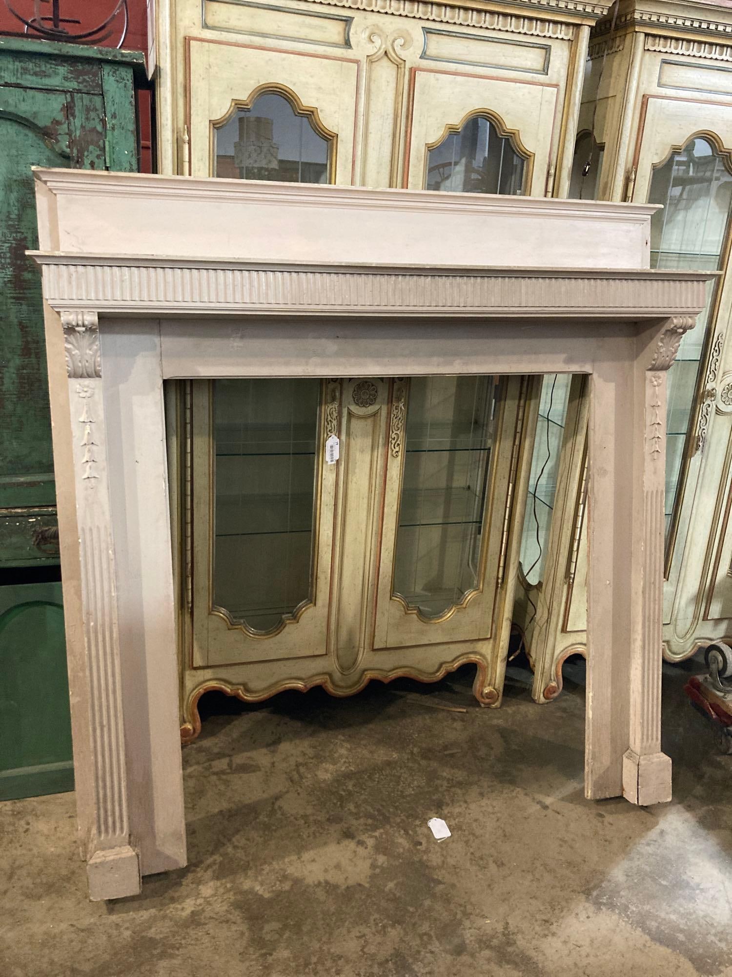 Carved Pillar Style Fireplace Mantle : Each side shows floral design with corbels and pillars. Mantle height is 54 inches with total dimensions 62 X 60 X 12. The fireplace hole is 45 X 41.