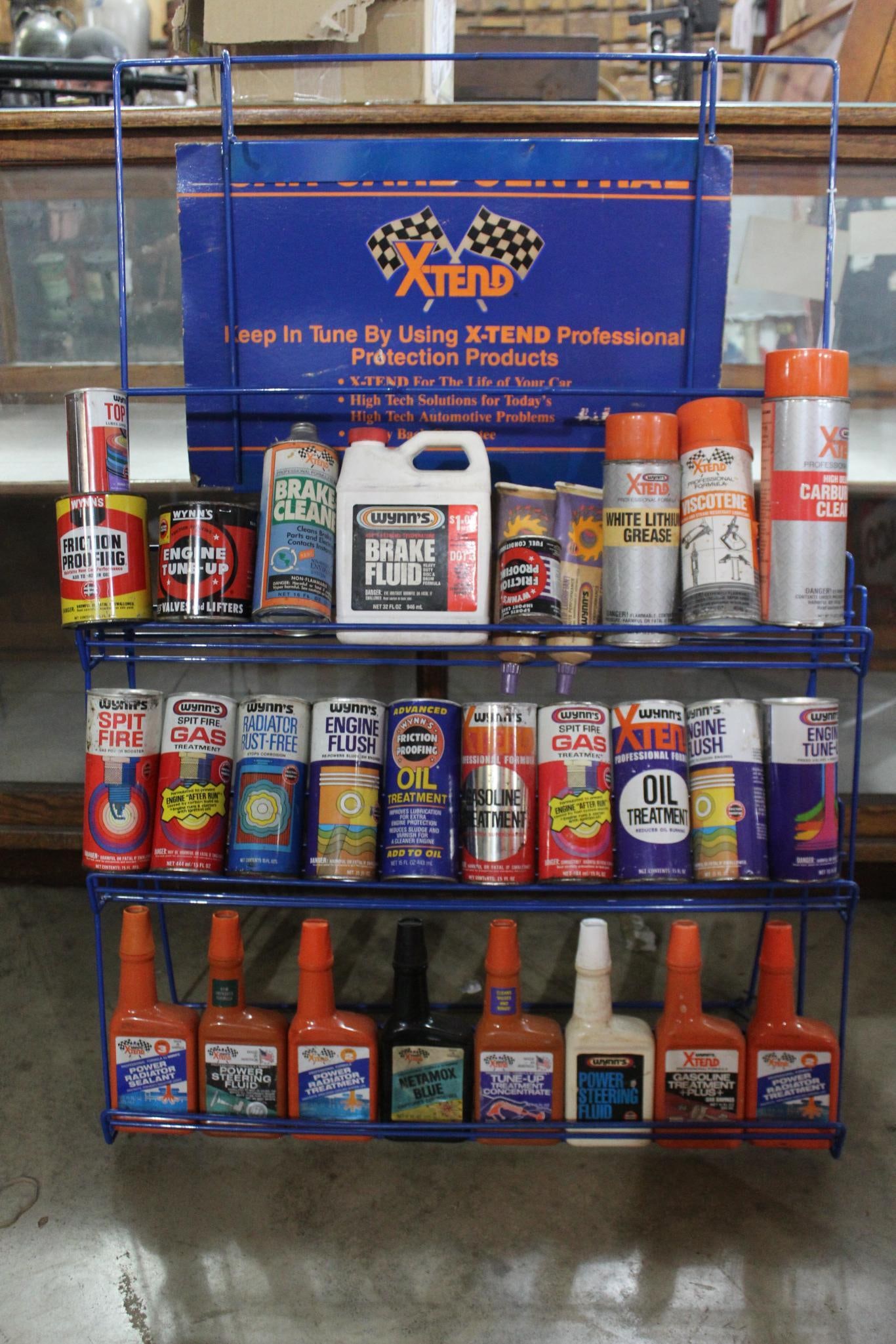 X-tend Lubricants display rack w/numerous cans (1 of 6)