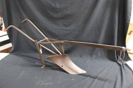 Early Salesman Sample Plow: All steel, this plow is a good sample of a life sized working cultivator. Total length is 40 inches X 16.5 inches tall.