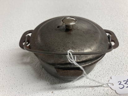 Griswold Miniature Dutch Oven: Table service. No 0. 2 in x 4 inch diameter.