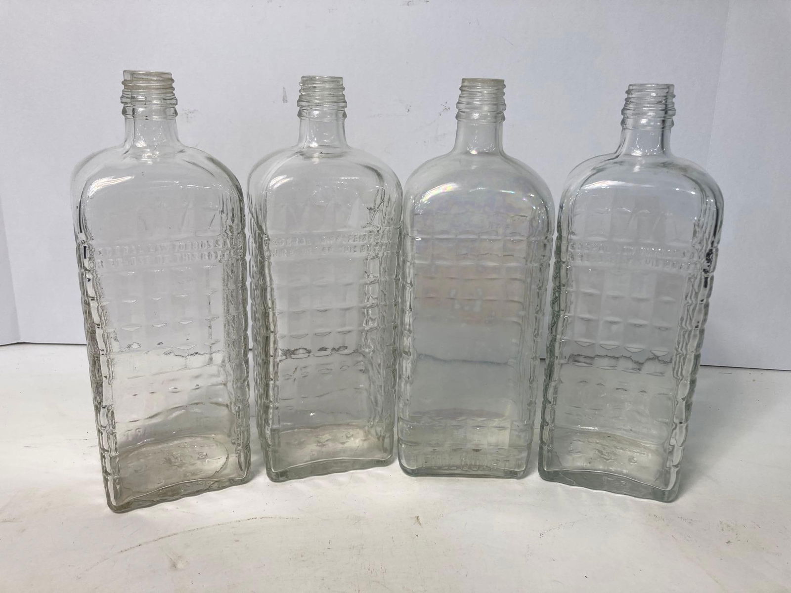 4 EARLY LIQUOR BOTTLES (1 of 4)