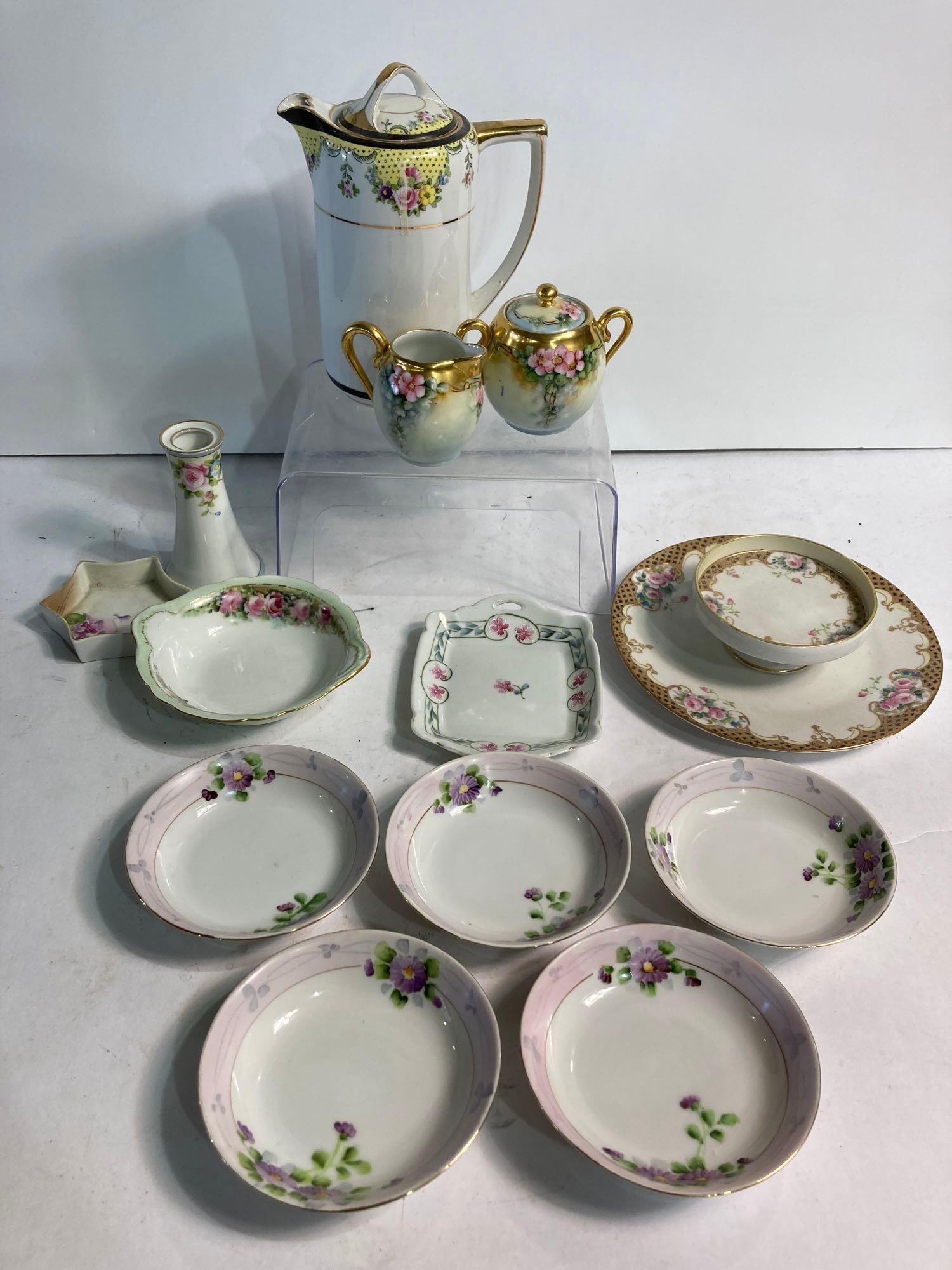 HAND PAINTED NIPPON & FRENCH TEA SETTINGS: all pieces in very good condition. Includes picture, vase, nut dish, saucers, cream, and sugar, and more. 13 pieces included. No chips or cracks.