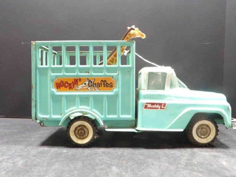 VINTAGE BUDDY L ROCKIN GIRAFFES TRANSPORT STAKE TRUCK: OUT OF BOX SHOWING CONDITION ISSUES DUE TO AGE AND PLAY INCLUDING RUSTING AND PAINT LOSS