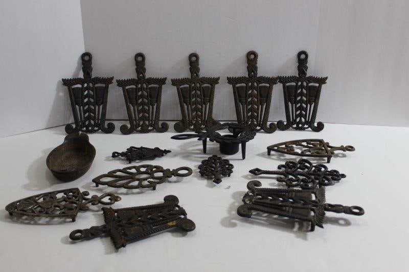 CAST IRON TRIVITS & LODGE PAN: MANY VARIOUS PATTERNS. 14 TOTAL, INCLUDING ON LODGE MINI OVAL PAN