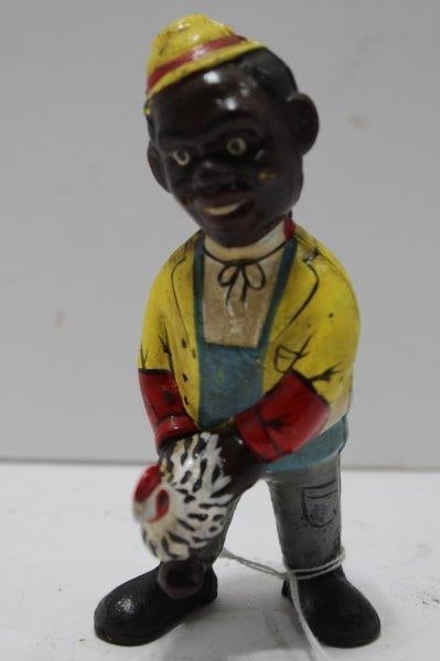 BOY WITH CHICKEN CAST IRON BANK: BANK IS 5.5 INCHES TALL