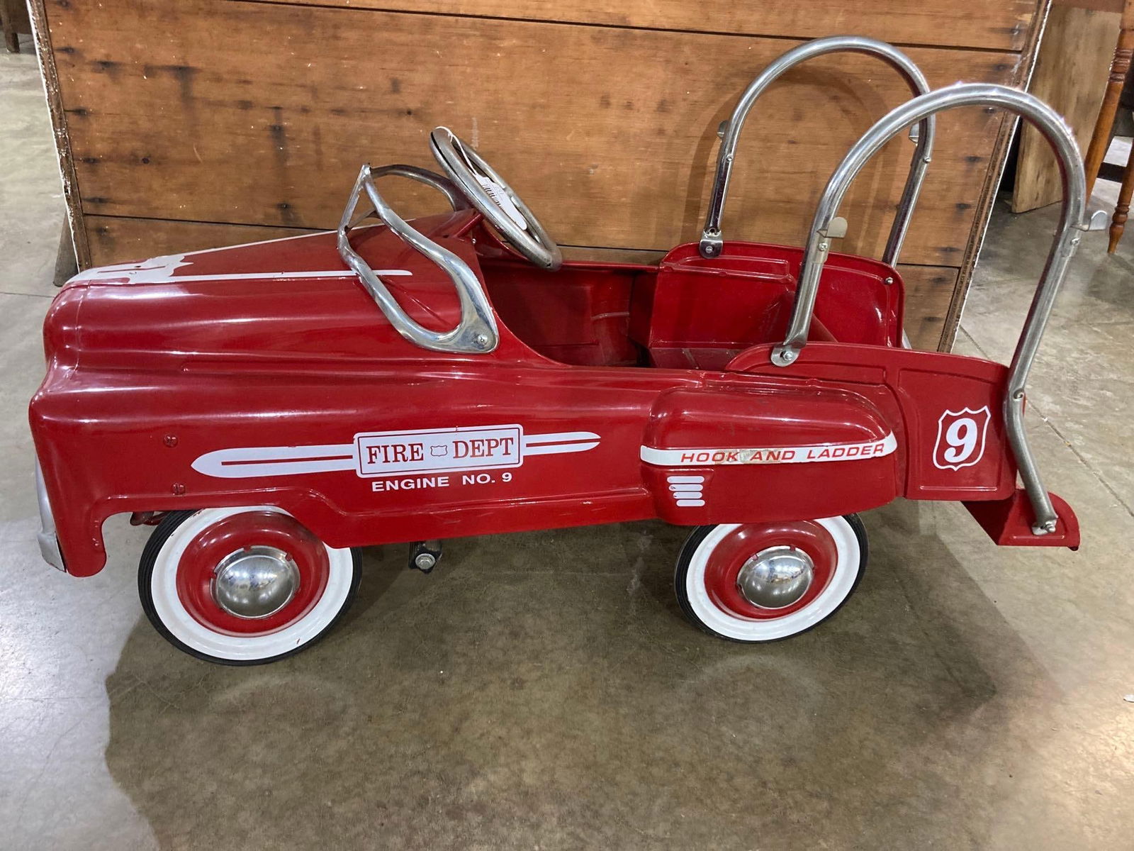 HOOK AND LADDER FIRE ENGINE PEDAL CAR: CAR IS IN GOOD CONDITION, NO RUST. IS MISSING BELL AND LADDERS. HAS MINOR SCUFFING THROUGHOUT. PEDALS AND WHEELS MOVE FREELY. 43 IN LONG