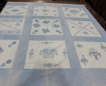 Handstitched cross-stitch quilt