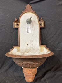 Early ornate porcelain and metal water basin