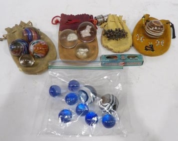 Various Marbles and Leather Pouches